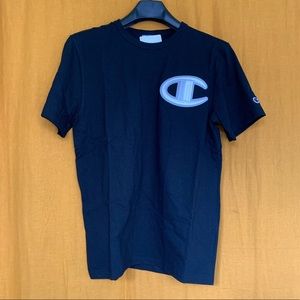 Black, large embroidered logo Champion t-shirt. New with tags.